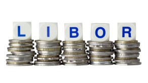 Stacks of coins with the letters LIBOR isolated on white
