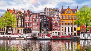 Amsterdam Netherlands dancing houses over river Amstel landmark