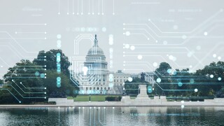 Capitol dome building exterior, Washington DC, USA. Home of Congress and Capitol Hill. American political system. The concept of cyber security to protect confidential information, padlock hologram