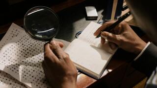 Deciphering symbols with a magnifying glass.jpg