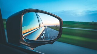 Side mirror of a car looking back