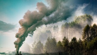 factory smoke covering green forest double exposure global warmi