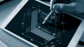 engineer working on computer on electrical piece design