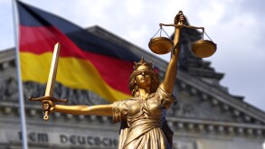Lady of Justice statue with German flag flying