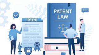 Owner holds patent for new idea or invention. Intellectual property paper document and patent law books. Copyright reserved or product trademark that cannot copy. Lawyer analysis copyright law.