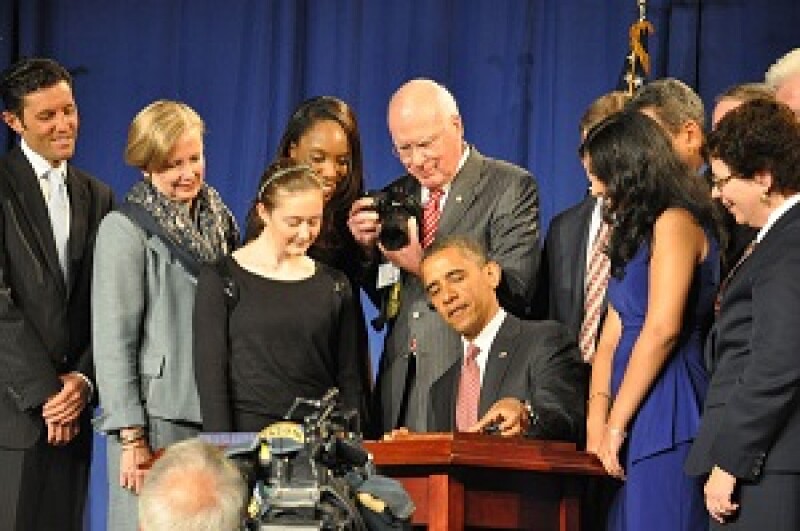 Obama signing the AIA