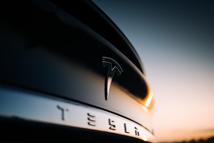 Tesla Model X P100D interior logo at the rear trunk. Elon Musk Tesla motor company bage and logo at the rear part of a car 