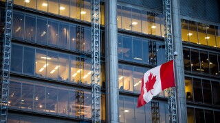 Canadian flag in front of a business building in Toronto, Ontario, Canada