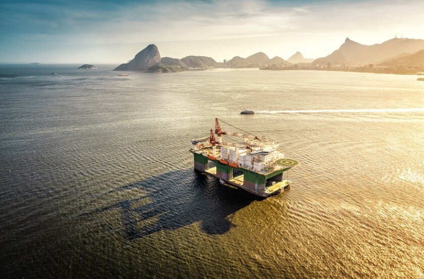 Oil drilling rig against panorama of Rio De Janeiro, Brazil