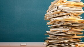 Stack file folders with documents on the desk