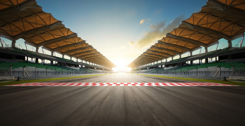Evening scene asphalt international race track with starting or 