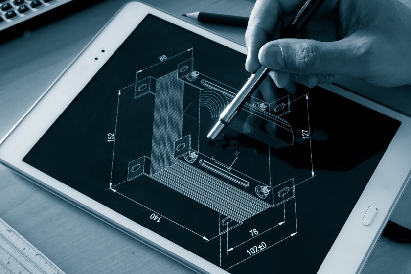 engineer working on computer on electrical piece design