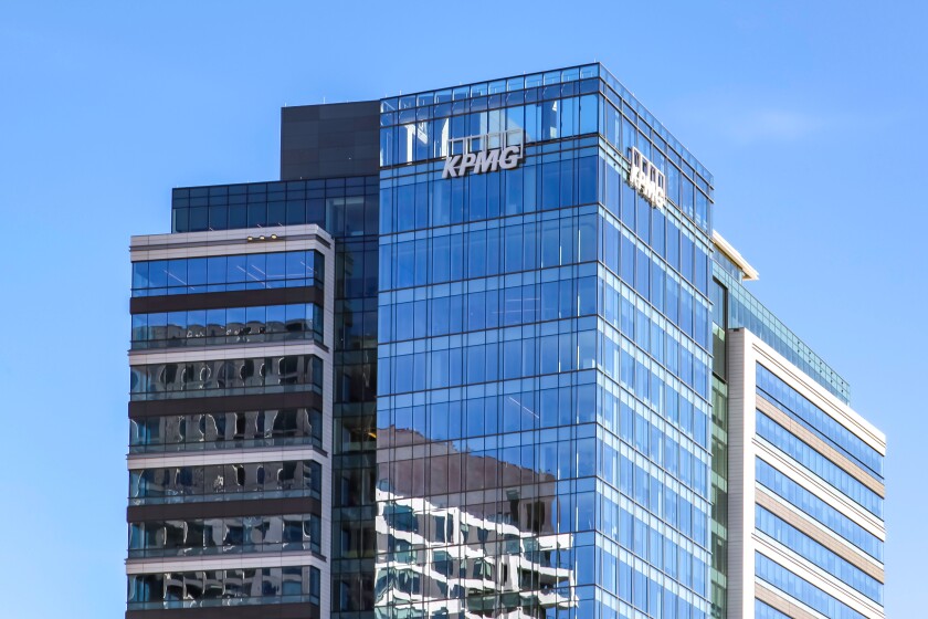 Tysons Corner, Virginia, USA- March 1, 2020: Sign of KPMG on the building in Tysons Corner, Virginia, USA. KPMG is a professional service company and one of the Big Four auditors, Seated in Netherland