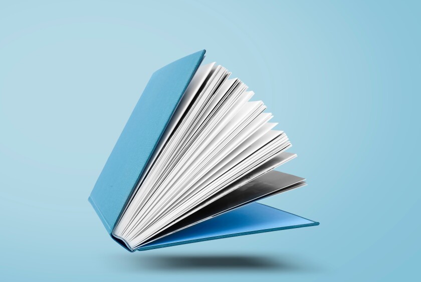 Large hardcover book with open pages