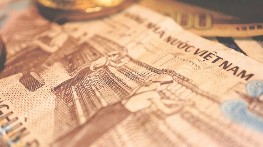 Close up the Vietnamese Dong Banknotes and Bitcoin