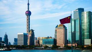 Chinese flag and the Beijing skyline