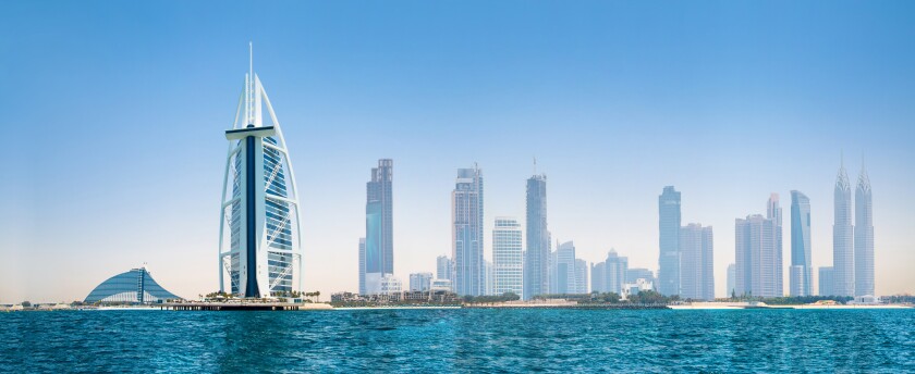UAE, United Arab Emirates. Dubai and the Persian gulf at sunset.