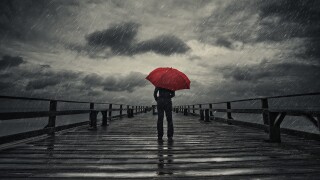 Red umbrella in storm