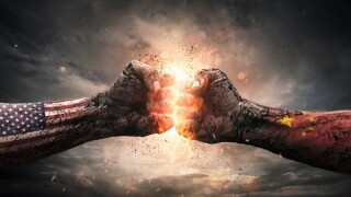 Conflict, close up of two fists hitting each other over dramatic background with copy space