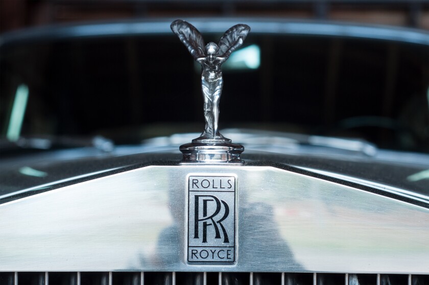 closeup of Rolls Royce logo on car