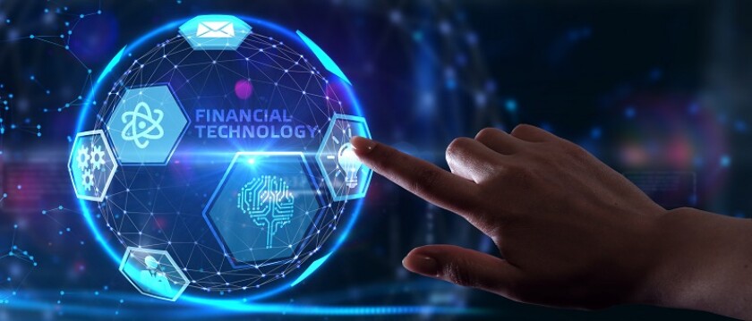 Fintech -financial technology concept.Young businessman  select the icon Fintech on the virtual display.