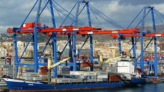 Large ship in dock being loaded