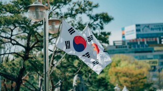 Two South Korean flags on lamppost