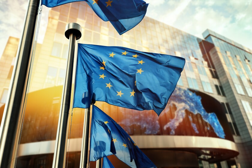EU flags waving in front of European Parliament building. Brusse