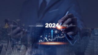Countdown to 2024 concept. the taps a virtual download bar with a loading progress meter on New Year's Eve, turning the year 2024 to 2025.