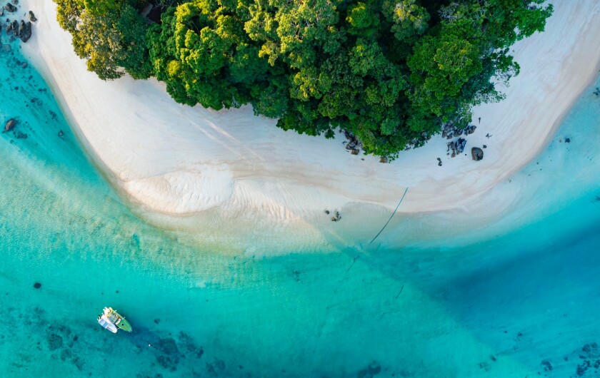 Top view of white sand beach tropical  with seashore as the isla