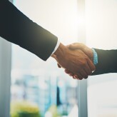 Business people, meeting and shaking hands for introduction, support and advice at law firm consultation. Lawyer, attorney or advisor with handshake for client deal, merger and welcome to partnership