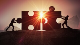 Teamwork, partnership and cooperation concept. Silhouettes of tw
