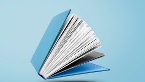 Large hardcover book with open pages