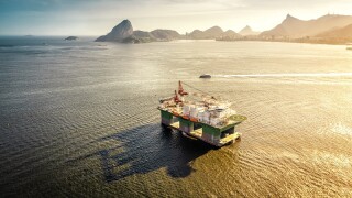 Oil drilling rig against panorama of Rio De Janeiro, Brazil