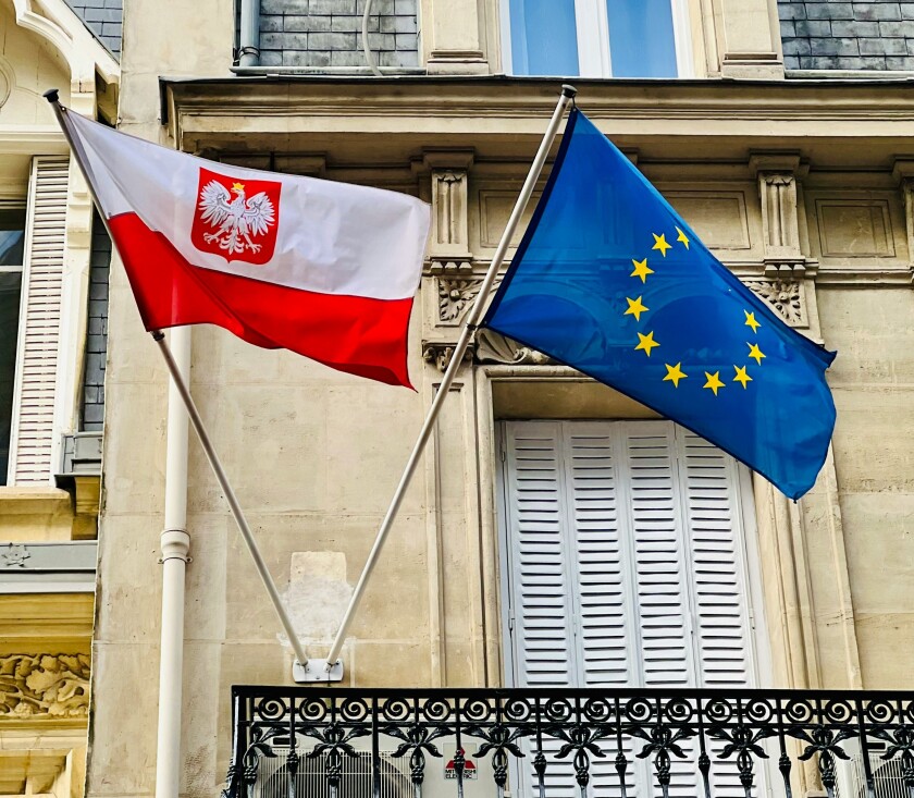 Polish and EU flags on balcony