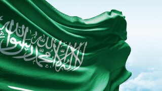 Saudi arabia flag in the blue sky. Horizontal panoramic banner.