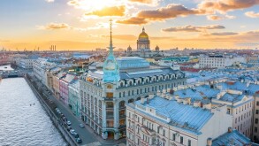 Department store shop class luxury, near the Red Bridge, historical buildings of Saint-Petersburg. In the background the city and St. Isaac's Cathedral dome of golden color, in the evening at sunset.