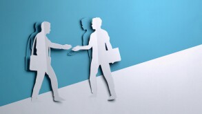Paper Art - two Businessmen shaking hands On A Deal