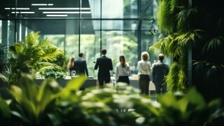 Office space with lush green plants. Sustainable and nature friendly corporate environment. Workspace for business productivity and employee wellbeing. Environmental responsibility in business, ESG