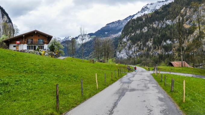 Road leading to Swiss mountain and chalet